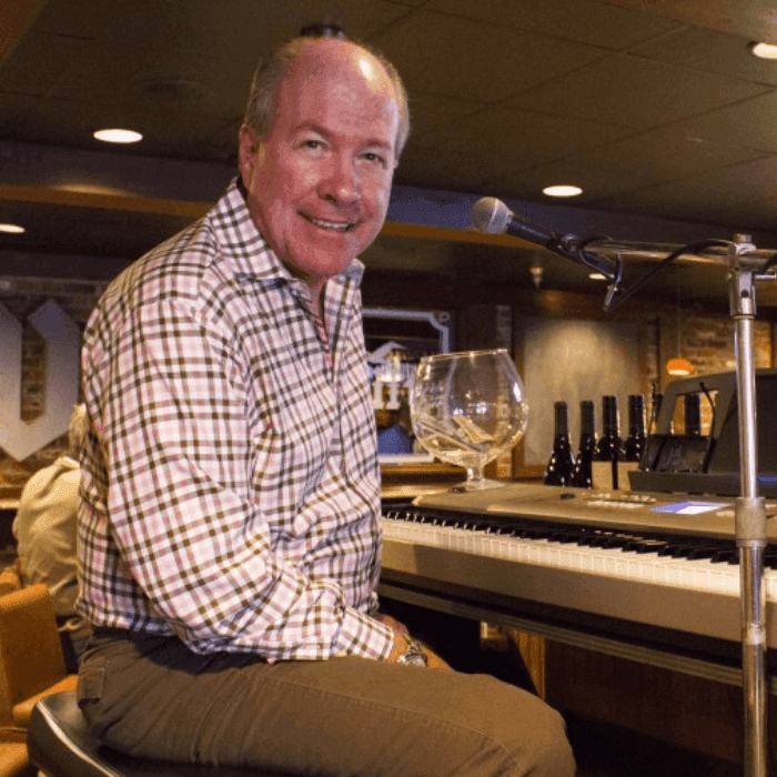 Singer & Pianist Jim Bannach at the Signature Lounge at ICONA Windrift in Avalon NJ smiling next to the microphone