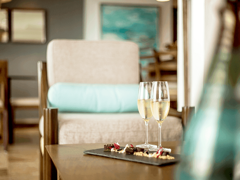 Close-up of two wine glasses served on a table at Villa Premiere Boutique Hotel & Romantic Getaway