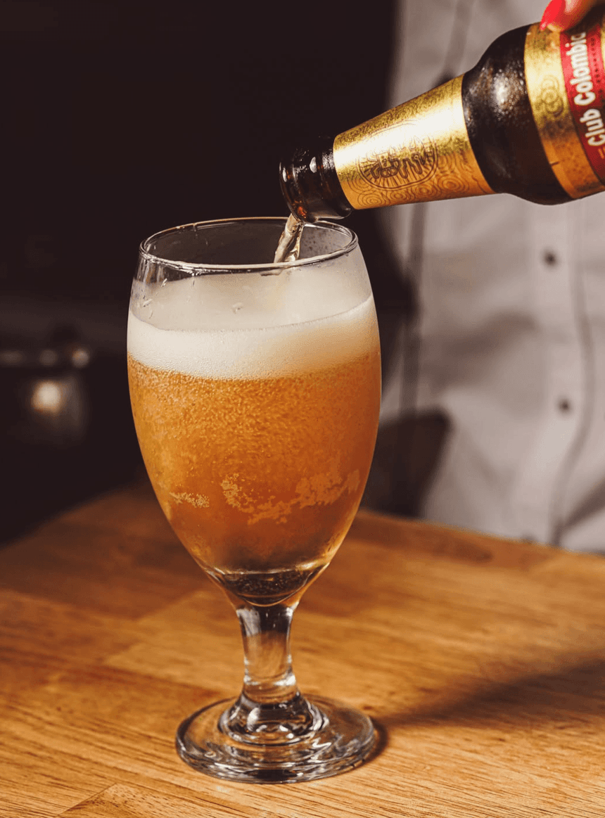 Cold beer being poured into a glass at the El Nogal Restaurant bar in Riviera Hotel South Beach