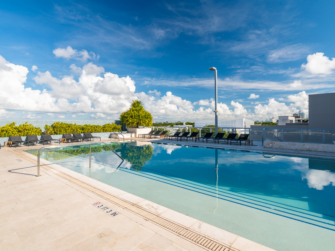 Pool area with sunbeds at South Beach Hotel