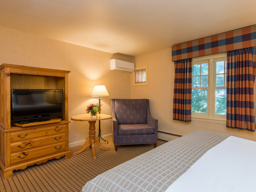 Interior of Select King Room with TV & Sofa at Wolfeboro Inn