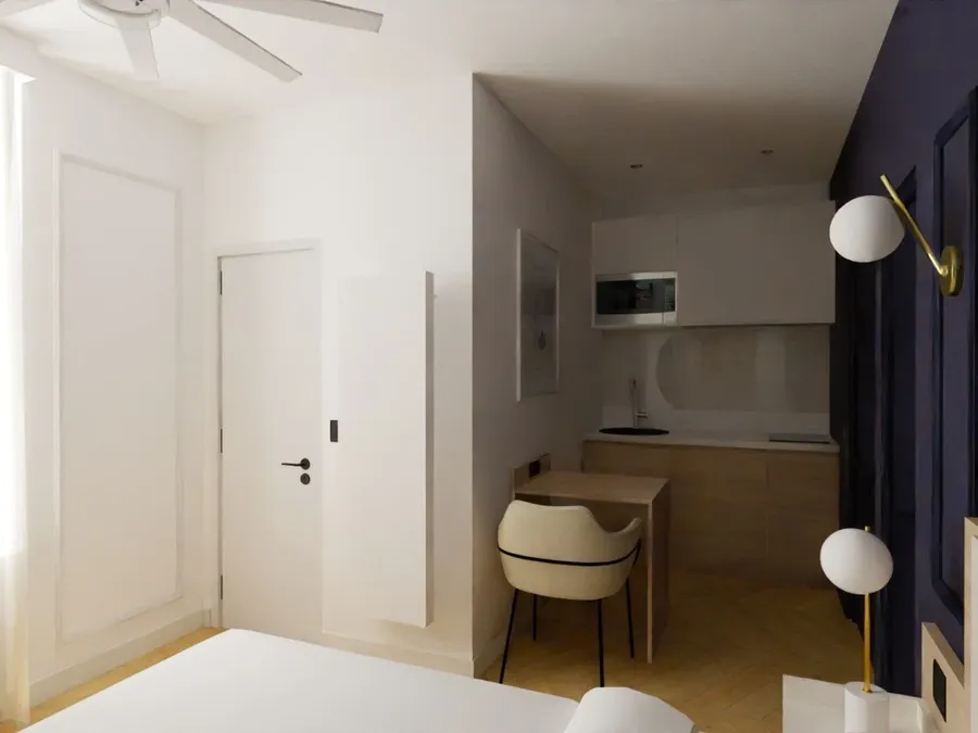 Chambre moderne avec cuisine et bureau intégrés chez Les Sources Callou.