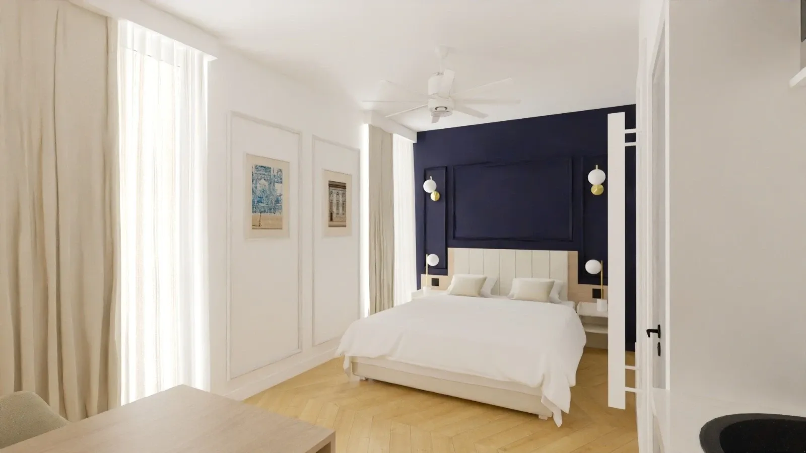 Chambre élégante avec lit, mur bleu, plafond blanc et ventilateur à Les Sources Callou.