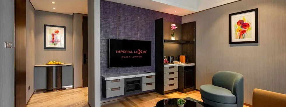 Sophisticated living area in a high-floor luxury hotel suite at Imperial Lexis KL with modern decor.