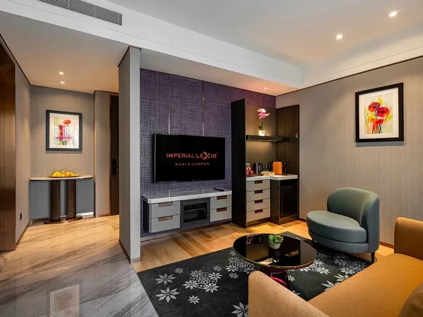 Sophisticated living area in a high-floor luxury hotel suite at Imperial Lexis KL with modern decor.