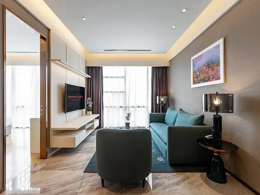 Spacious modern living area in a 3-bedroom residential suite for families.