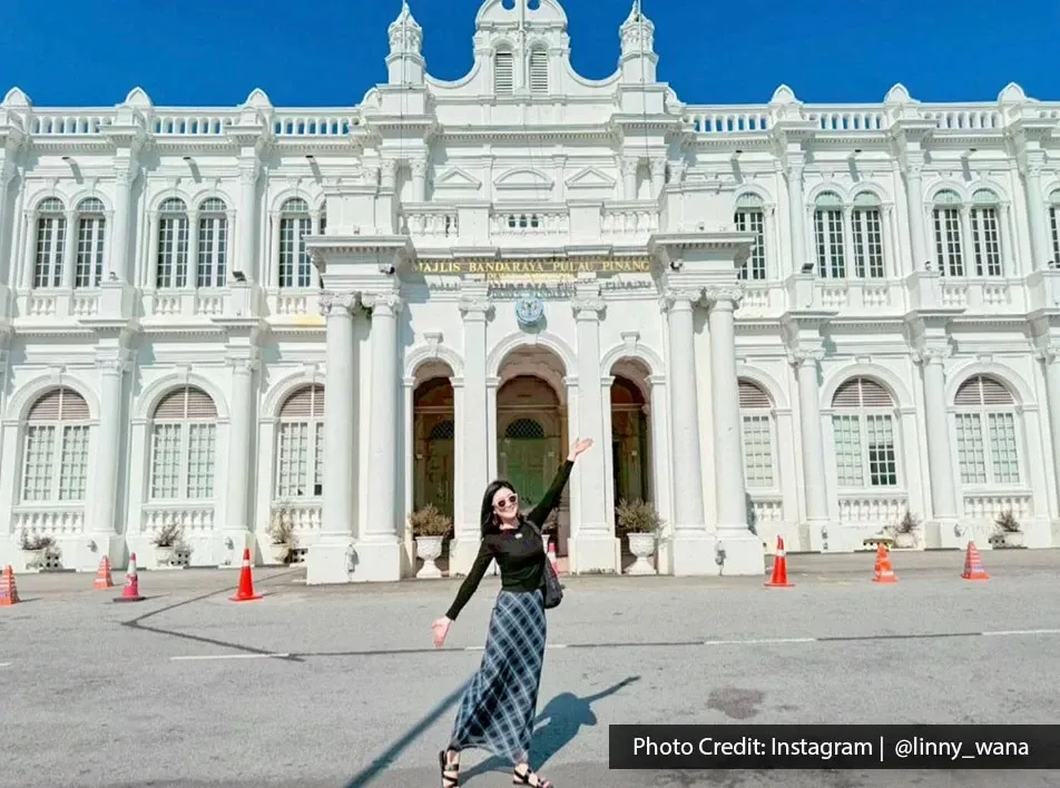 Tourist standing at Penang Town Hall historic landmark in George Town Penang.