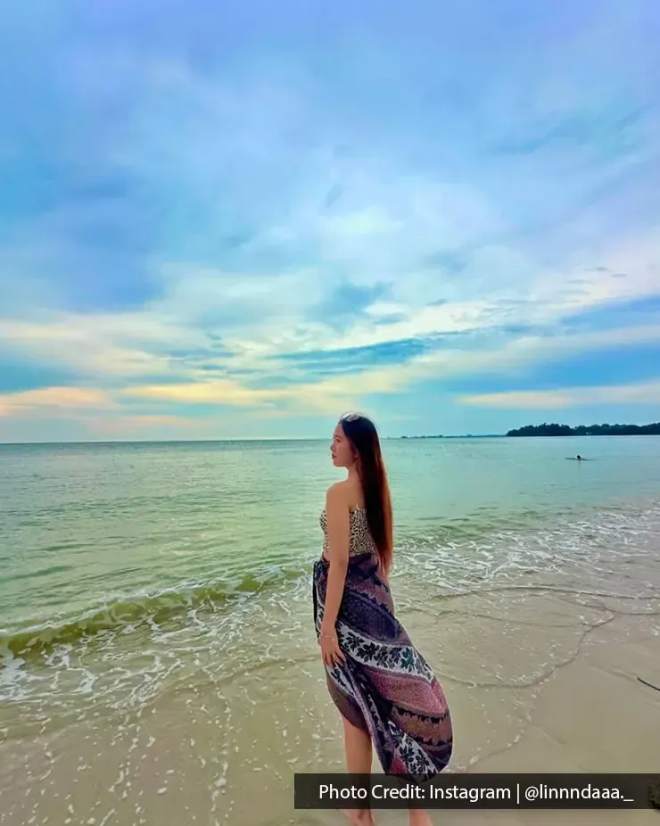 Lady relaxing by the sea at Teluk Kemang Beach- Lexis Hibiscus Port Dickson