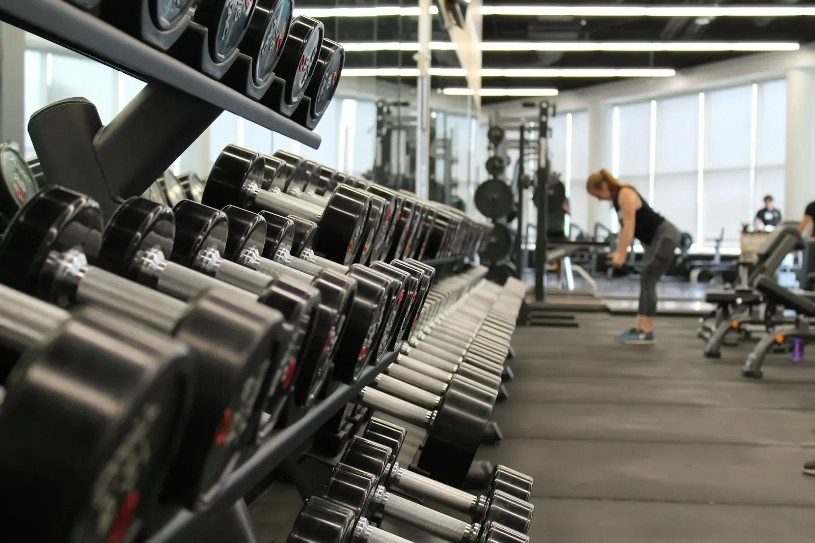 A rack of dumbbells in a modern fitness club