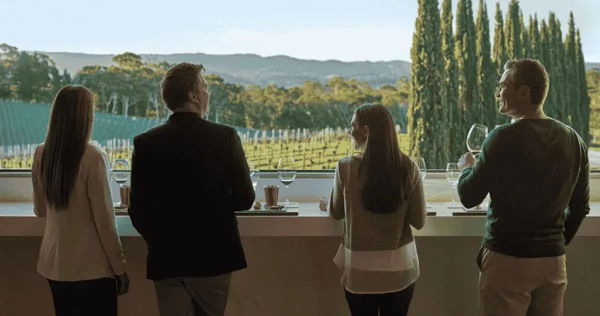 A group of people enjoying a wine tasting at The Lane Vineyard in the Adelaide Hills