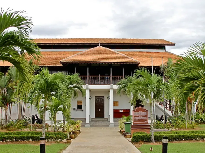 Exterior view of Lukut Fort and Museum featuring a prominent red roof against a clear sky - Lexis Port Dickson