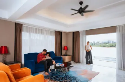 Family relaxing in the resort room with a view - Lexis Hotels & Resorts