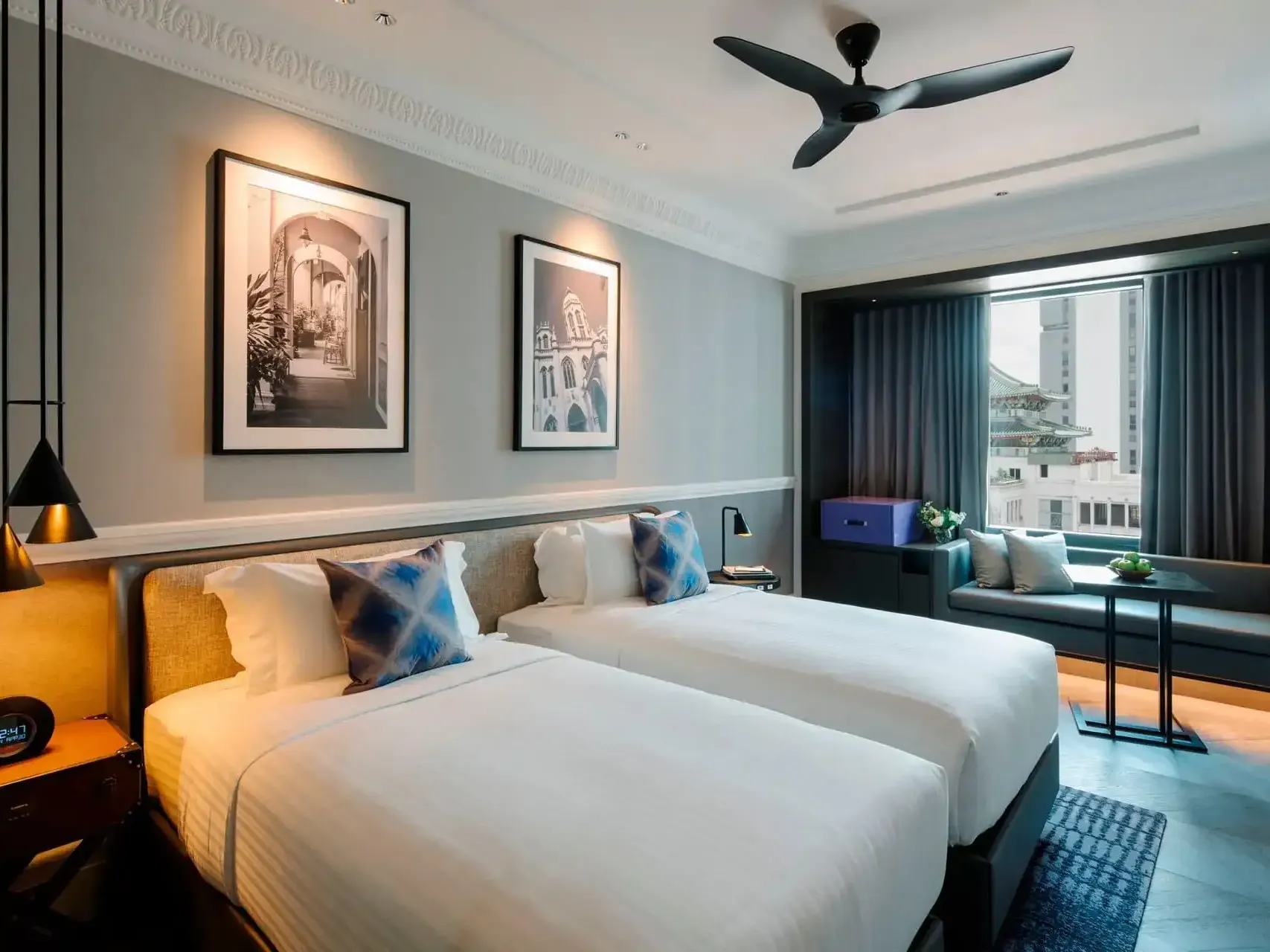 Sitting area & nightstands by the cozy beds in Crystal Club Premier Room at Grand Park City Hall