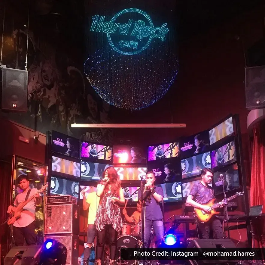 Night performance with live band on stage at Hard Rock Cafe Penang.