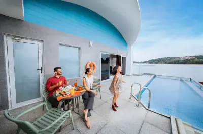 Family enjoying meal and sea view by the private pool - Lexis Hotels & Resorts