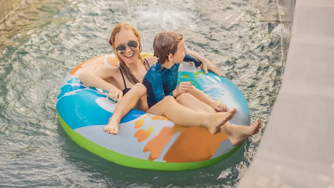 Splash Out Staycation poster with mother and child on a large inflatable ring in the pool at Sunway Velocity Hotel