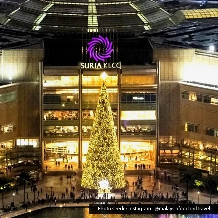 Exterior of Suria KLCC shopping mall at night in Kuala Lumpur