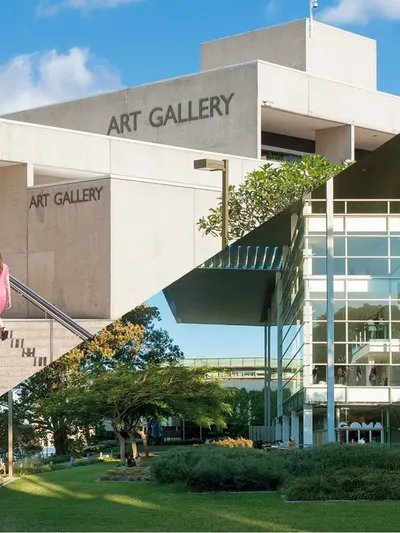 Modern white concrete art gallery building with glass walls, outdoor stairs, and landscaped gardens at QAGOMA.