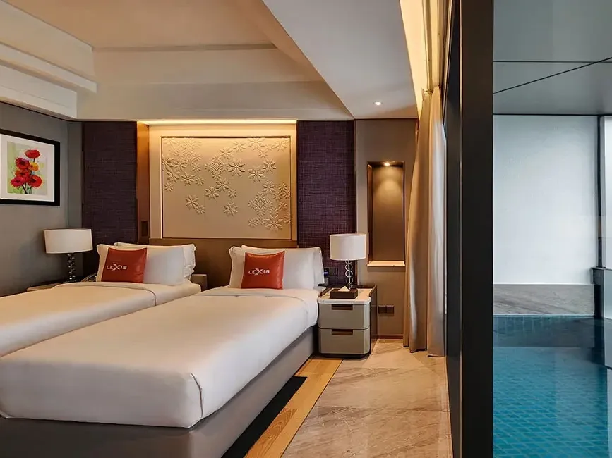 Spacious Executive Pool hotel room at Imperial Lexis Kuala Lumpur with modern twin beds and designer interiors.