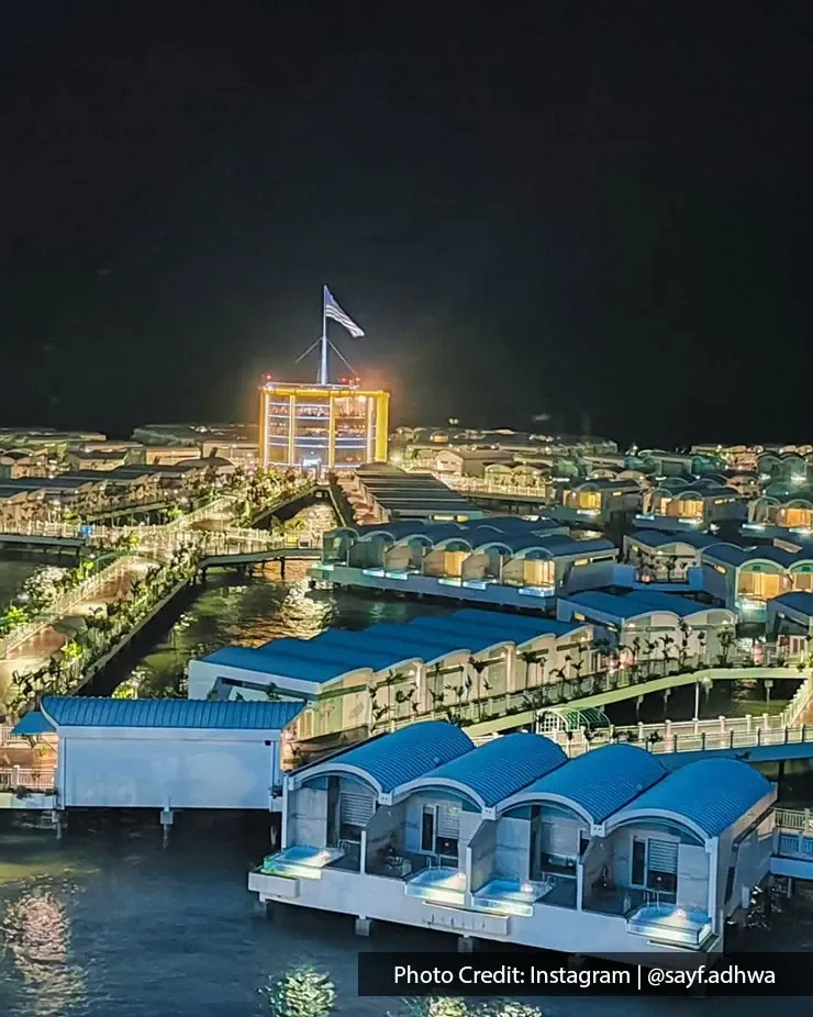 Lexis Hibiscus resort glowing at night.