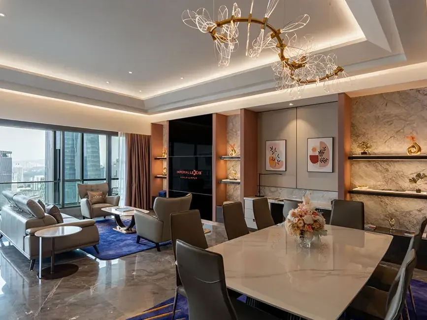 Expansive open-plan living and dining area in the Imperial Pool Suite with luxury marble floors.