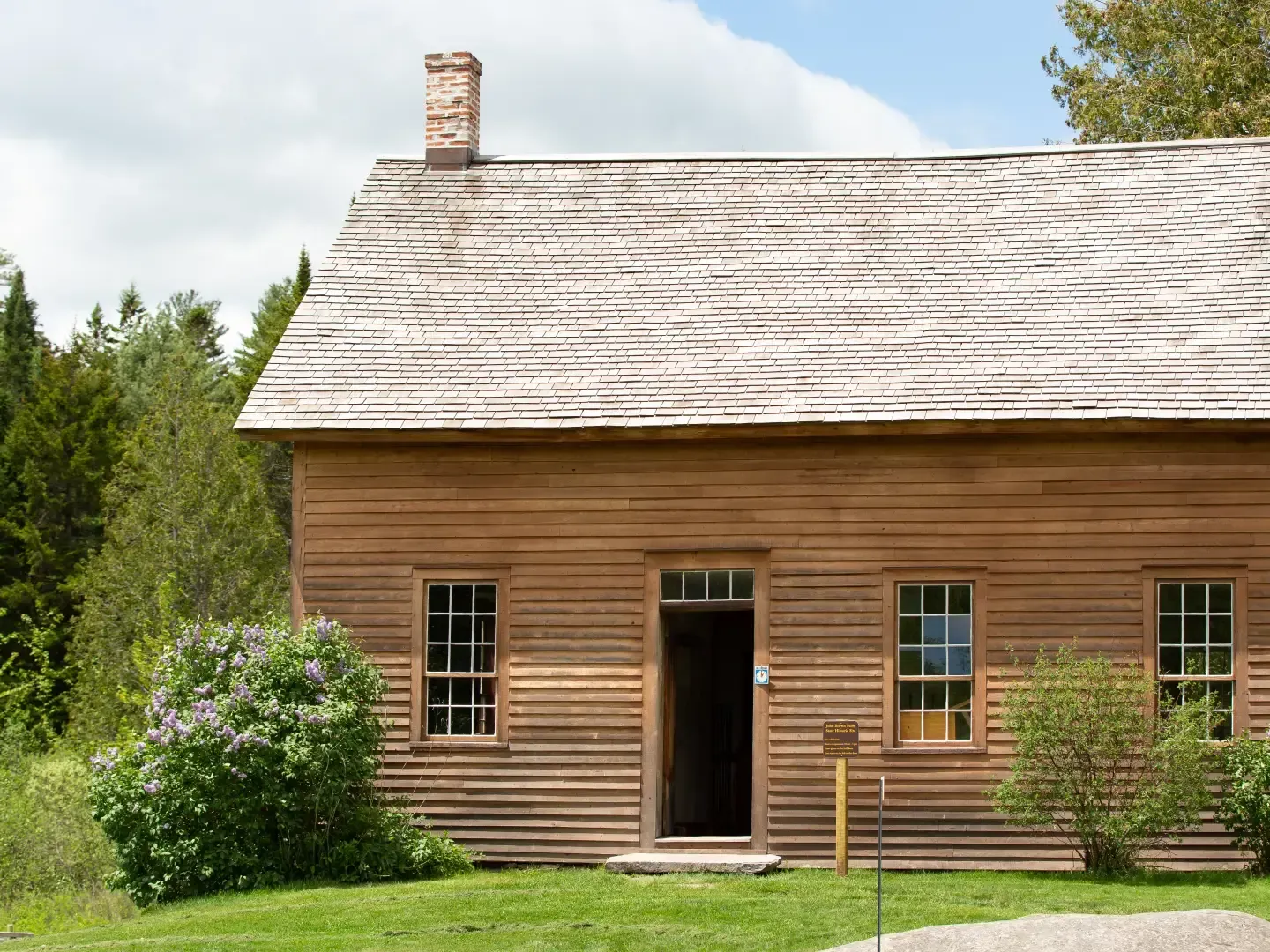 The simple rustic wooden exterior of John Brown farm state near the Lake Placid Club Grandview resort