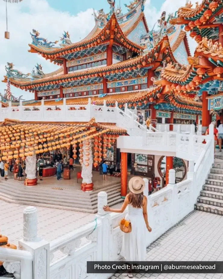 Woman overlooking the lantern courtyard at Thean Hou Temple