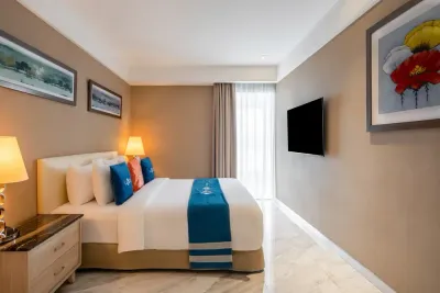 Royal suite bedroom with hanging artwork – Lexis Hibiscus Port Dickson