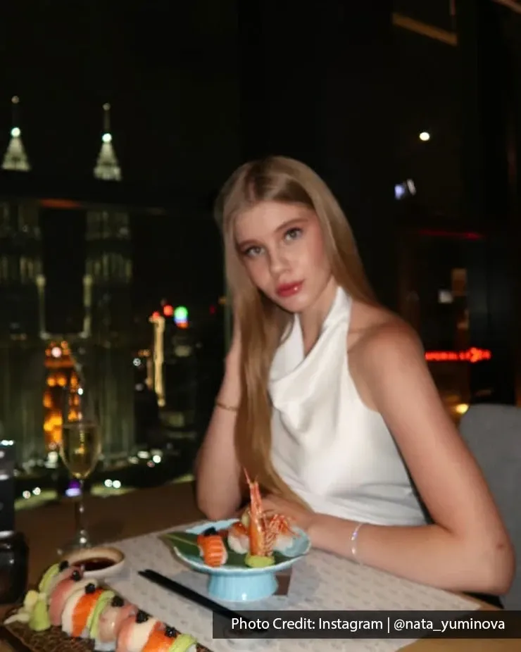 Woman dining with Petronas Twin Towers views at Imperial Lexis Kuala Lumpur