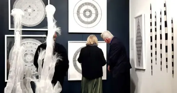 An older couple explore Auckland artwork at a museum art gallery