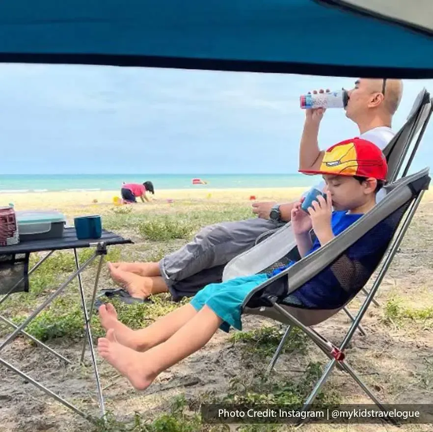 Father with son sitting near the beach - Lexis Hibiscus