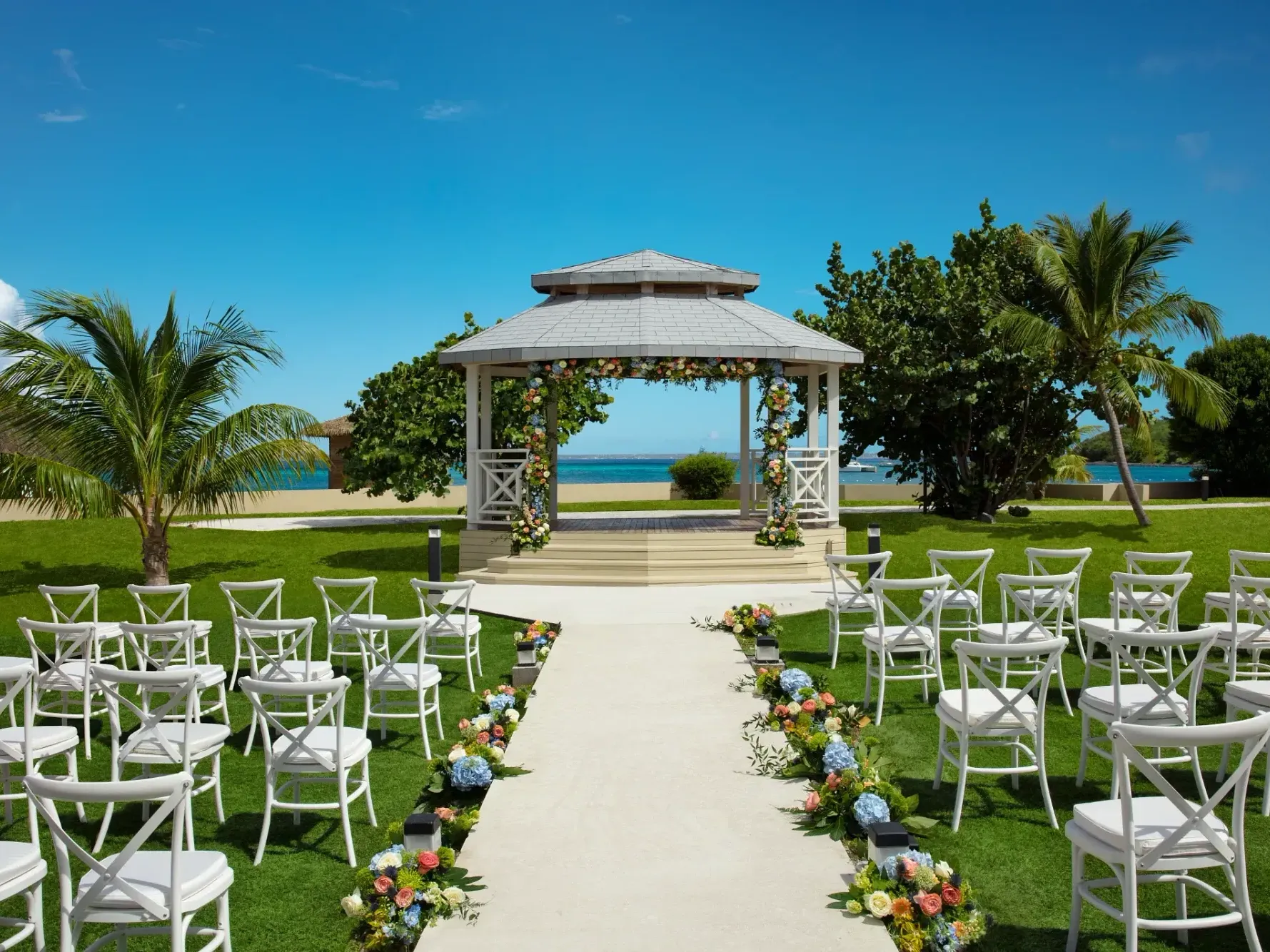 Beautiful outdoor wedding ceremony setup at Saint Martin Beach Resort & Spa, featuring St. Martin vacation packages