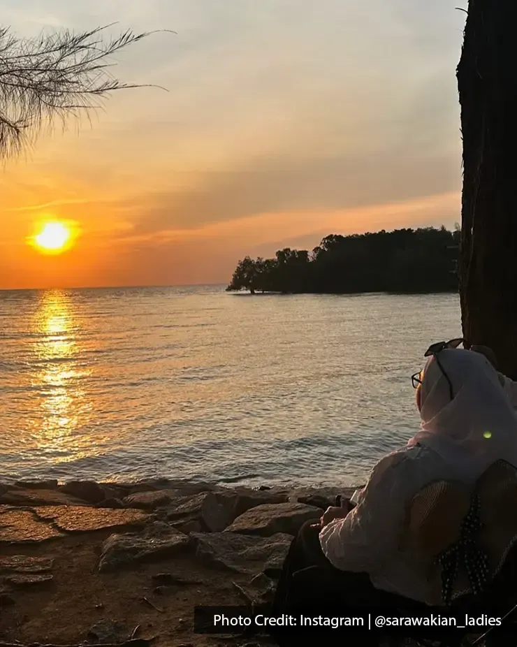 Woman watching sunset at Pantai Cahaya Negeri Beach - Lexis Hibiscus Port Dickson