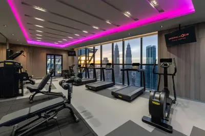 Modern O2 Gym at Imperial Lexis featuring a stunning KLCC view for hotel suite guests.