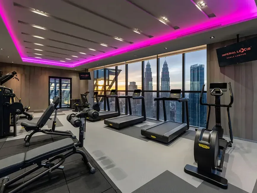Modern O2 Gym at Imperial Lexis featuring a stunning KLCC view for hotel suite guests.