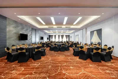 Banquet hall with black and gold setup – Lexis Hibiscus Port Dickson