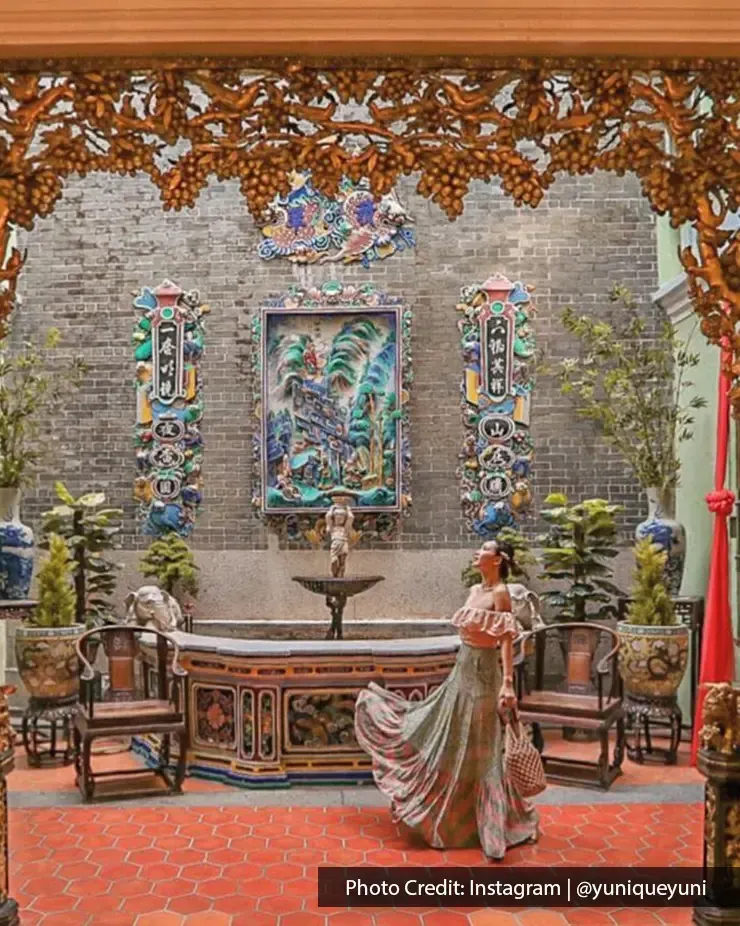 Woman in flowing dress inside Pinang Peranakan Mansion – Lexis Suites Penang