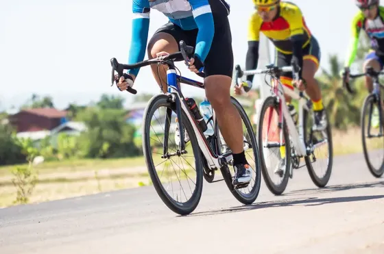 Cyclists competing in a road race showcasing sporting spirit - Imperial Lexis Kuala Lumpur