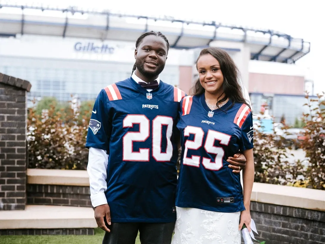 Bride and Groom standing outside of Gillette Stadium at the Renaissance Patriot Place Wedding Venue