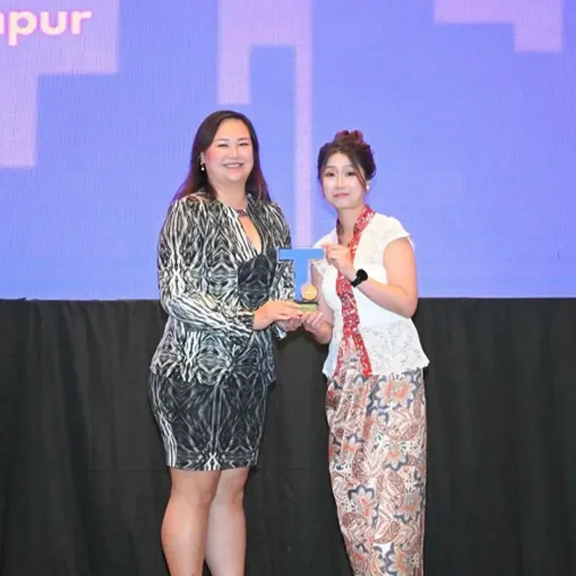 Lexis Hotel Group receiving an award at the Trip.com Partner Night - Lexis Hotel Group