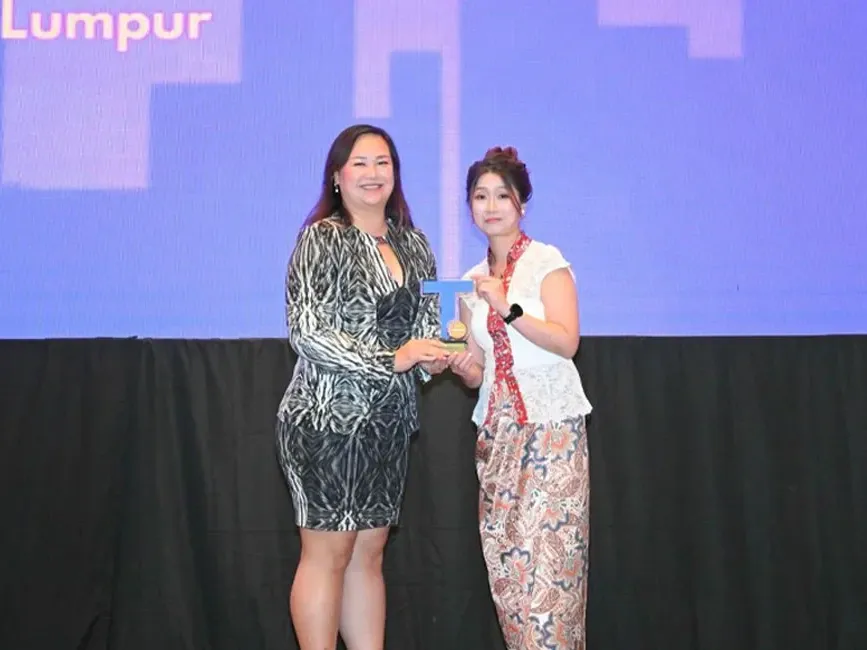 Lexis Hotel Group receiving an award at the Trip.com Partner Night - Lexis Hotel Group