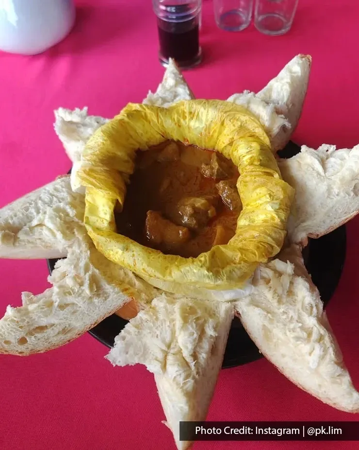 Lucky King Bun signature curry chicken bun with golden crust.