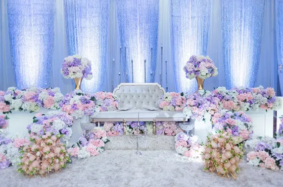 Romantic Dua Sejoli Malay themed wedding stage with floral arrangements – Imperial Lexis Kuala Lumpur