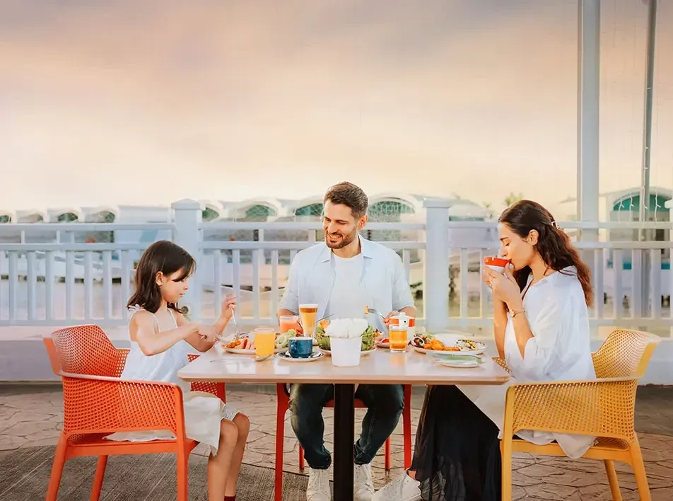 A family enjoying a meal together during their weekend staycation - Lexis MY