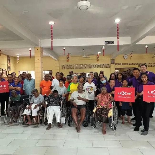 A group of people posing for a photo at Persatuan Kebajikan Vinashini - Lexis Hotel Group