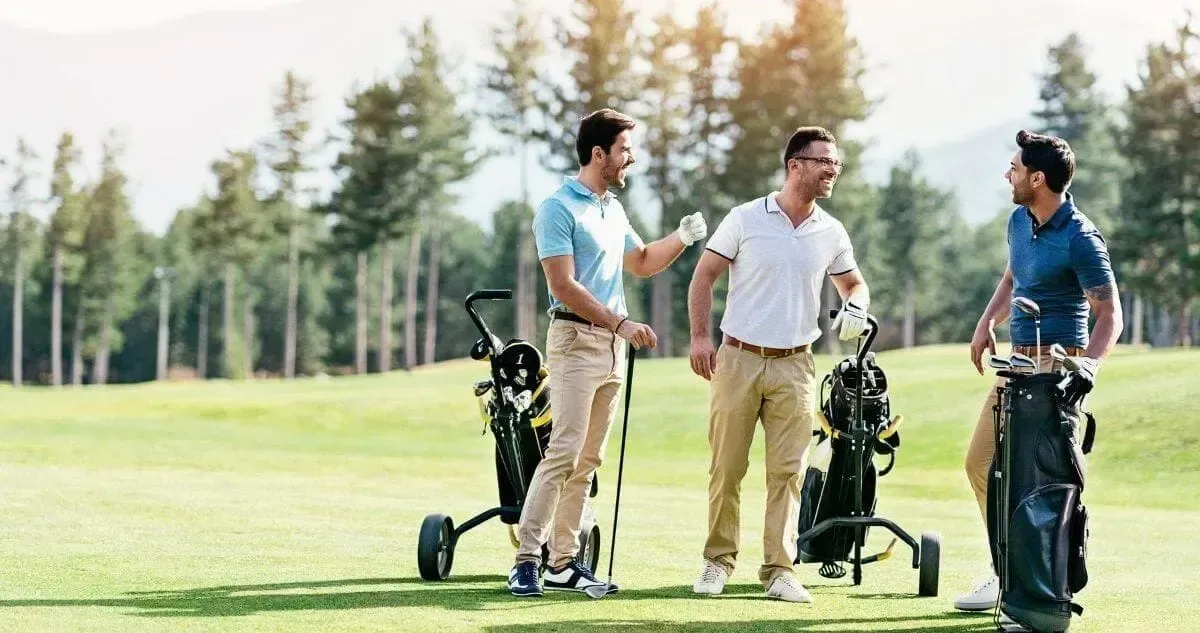 Three male golfers enjoying a chat on a Launceston golf course