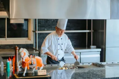 Chef preparing food at UMI Japanese Restaurant kitchen - Lexis Hibiscus Port Dickson
