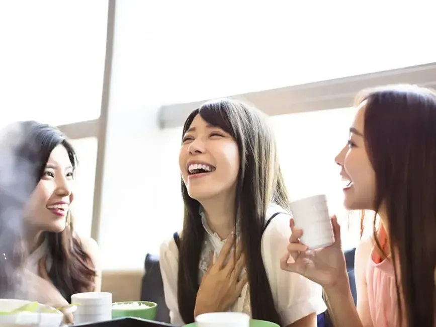 Group of friends enjoying a meal and chatting together - Imperial Lexis Kuala Lumpur