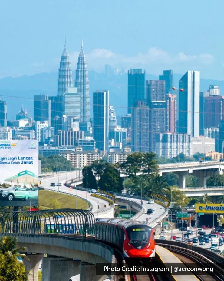 Rapid KL train with Petronas Twin Towers in the background