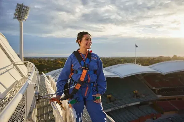 Climber taking in the view on a RoofClimb of Adelaide Oval